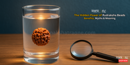 Authentic Rudraksha beads mala placed on a wooden surface with soft lighting – spiritual jewelry by NakshatraOne